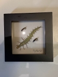 Wanduhr mit Fliegenmuster