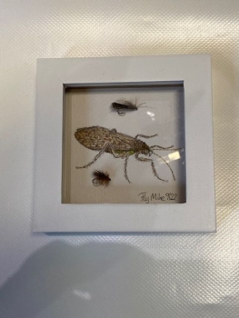 Wanduhr mit Fliegenmuster